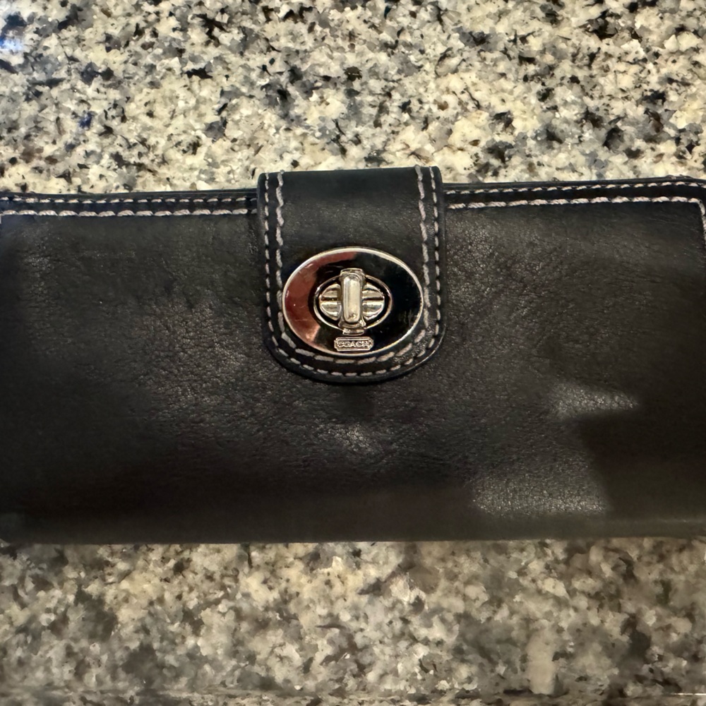 Coach Wallet. Beautiful black color. Has a lot of room.